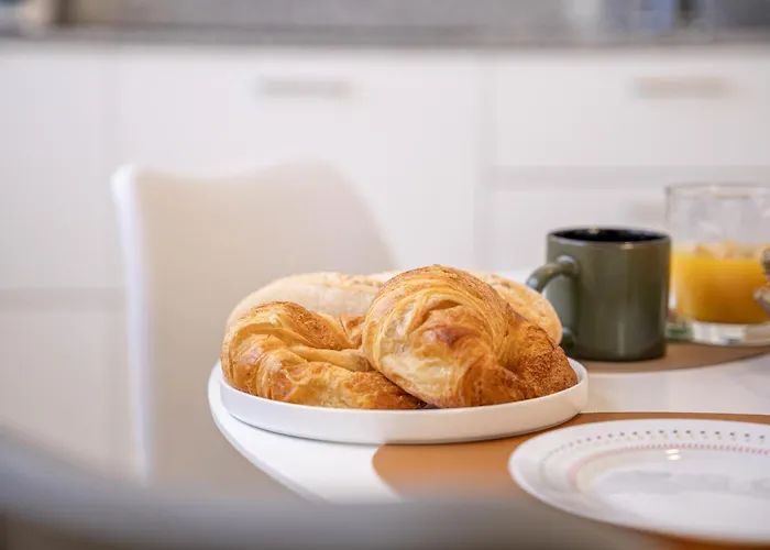 Greta, Cocqueto En דירה ארסיפה